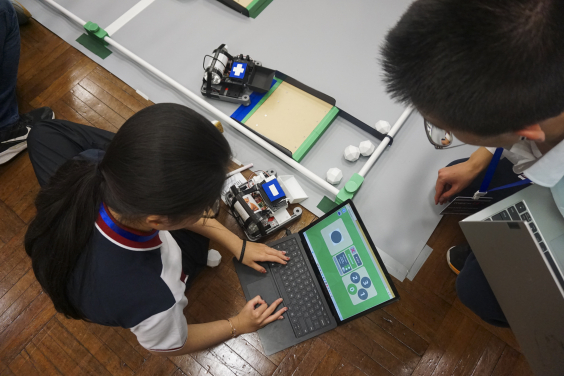 Students competing during the robotics challenge session